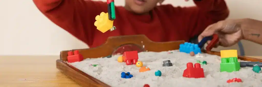 Sensory play for preschoolers using colorful sensory bins
