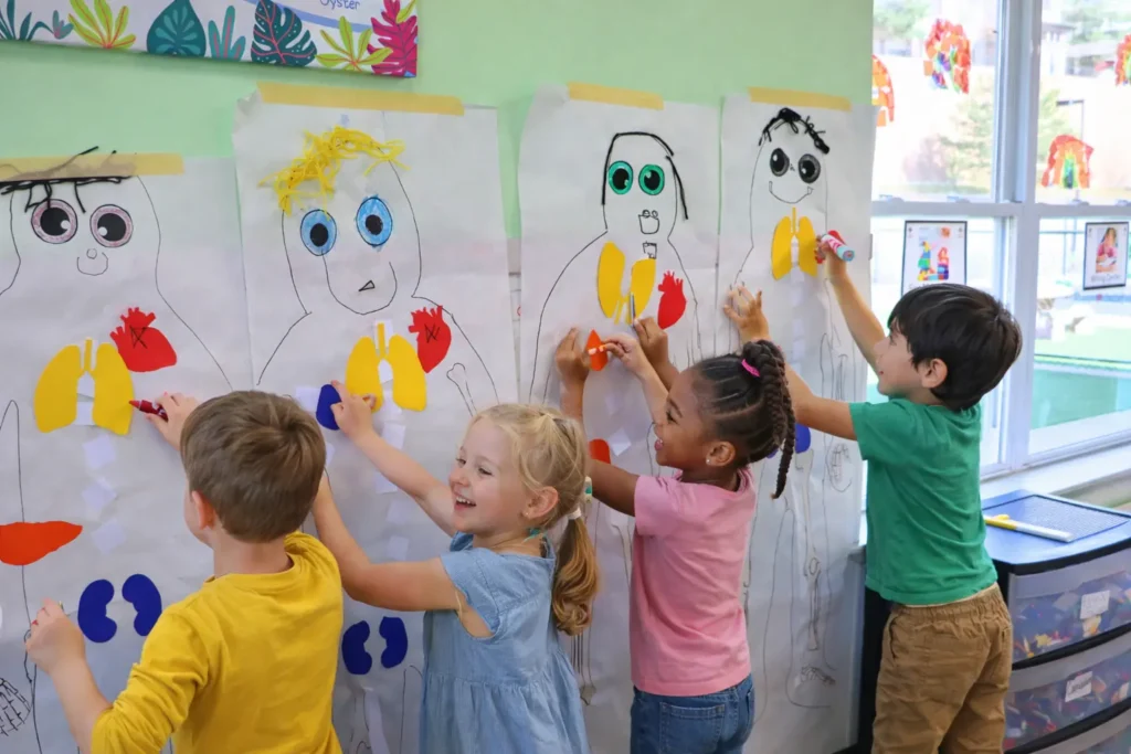 Quality preschool classroom with children participating in a STEM science experiment