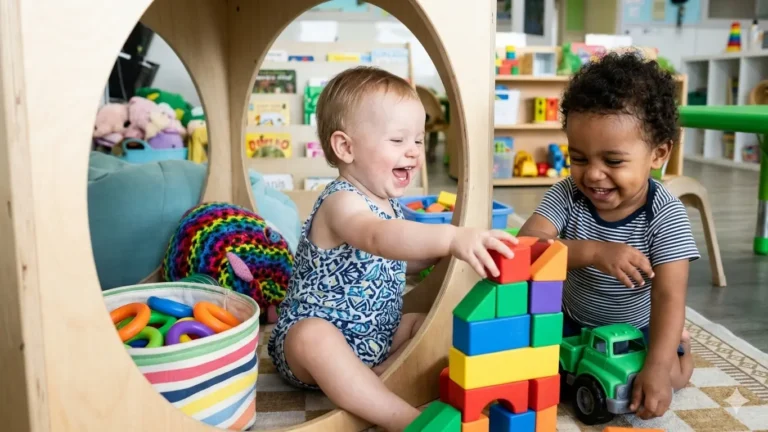 Child building tower during hands-on learning for toddlers